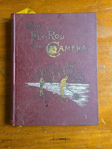 With fly rod and camera - rod,