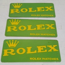 Insegna Rolex in metallo