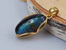 ciondolo ambra blu, oro e