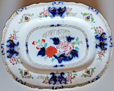 Antico piatto ovale in ceramica cm 34x27x3.5 smaltato con decorazioni floreale