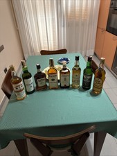 8 Bottiglie Di Liquore Vedi