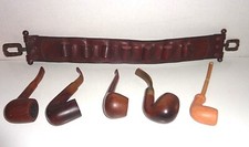 4 PIPE IN RADICA  E 1 IN ARGILLA  + CINTURA PORTAPIPE O CARTUCCERA IN CUOIO 