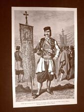 Nel Montenegro nel 1877 Pope in tenuta da guerra che porta bandiera della Chiesa