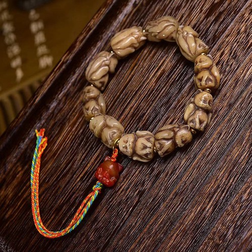 Bracciale perline intagliate