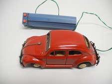 Raro giocattolo di latta rosso