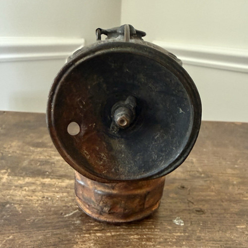 Antica lampada testa minatore