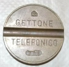 GETTONE TELEFONICO  con  zecca CMM con NUMERO di SERIE 7711(2)77 attaccato bordo