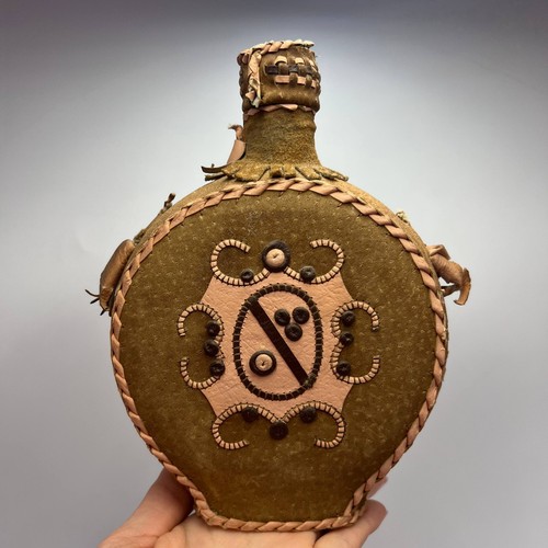 Handmade leather wrapped glass - wrapped,