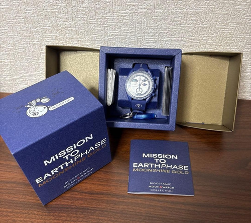Swatch omega mission - swatch,