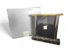 Cornice Amarcord di Ettore Sottsass per Morellato in marmo, vetro e metallo