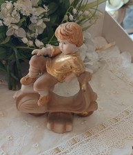 Vespa con bimbo in porcellana