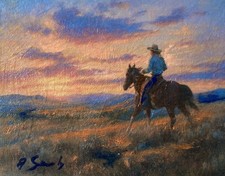 Cowboy a cavallo al tramonto -