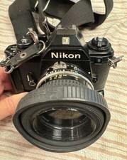 Fotocamera reflex Nikon EM VINTAGE con obiettivo Nikon Nikkor 50 mm e unità motore MD-E Power