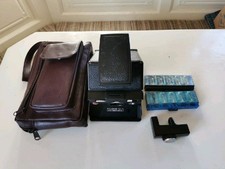 Polaroid SX 70, inclusa custodia in pelle