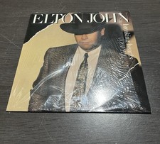 Elton John “Breaking