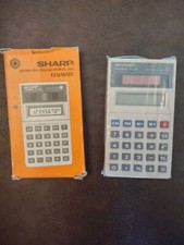 NUOVA calcolatrice tascabile vintage Sharp ELSI-MATE EL-240 cella solare made in Japan