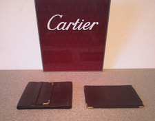 CARTIER  PORTAFOGLIO E BUSTINA DA BORSA  CARTIER WALLET AND POUCH