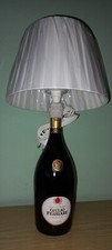 lampada da tavolo fatta con bottiglia di Vino Giulio Ferrari Ris. Trento Doc