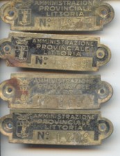 Lotto di 4 placchette periodo fascista provincia di Littoria fascio cm. 1x4
