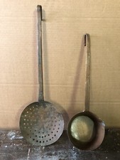 Antica schiumarola e antico