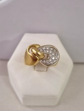 Vendo 89€ al Gr anello fascia oro giallo e bianco 18 carati usato con diamanti.