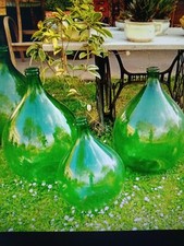 Damigiane in vetro verde per