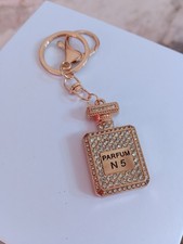 UNA BOMBONIERA SEGNAPOSTO PORTACHIAVI COMPLEANNO COMUNIONE PROFUMO BOTTIGLIA N5