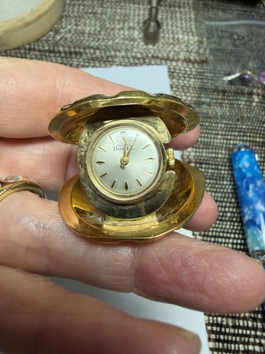 Collana con ciondolo orologio