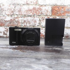 RICOH CX4 10MP Zoom 10,7x fotocamera digitale compatta - nero e caricatore