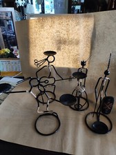 4 omini in ferro battuto portacandela assortiti