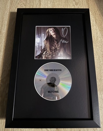 Signed miley cyrus something - signed,