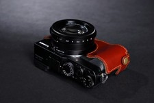 Custodia mezza fotocamera vera pelle per Panasonic LX100 fondo APERTO。