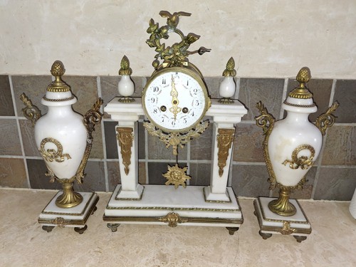 Portico clock and cassolettes