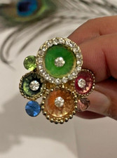 Gemme e Swaroski in oro