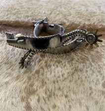 Coppia speroni western in acciaio inox per adulti design bordo dentellato