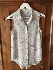 H&M camicia senza maniche in tessuto trasparente fiorato.Taglia 40/42.Nuova