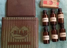  LOTTO FLACONI DI ESSENZE AROMATICHE IN VETRO AMBRATO IN SCATOLA LATTA ELAH 