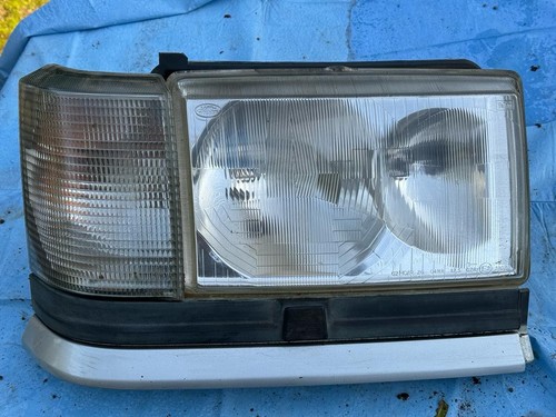 Faro anteriore con - faro, freccia
