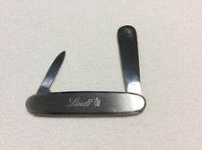 LINDT COLTELLO COLTELLINO PUBBLICITARIO LAMA + SPATOLA CHIUDIBILE ACCIAIO