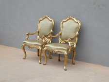 Coppia di poltrone dorate