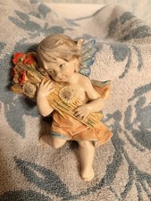 Statuina angelo estivo