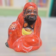 Statuina Hotei o Daruma in
