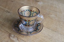 Bicchiere/tazza e piattino da