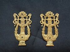 Coppia di fregi in ottone, fine 800- inizio 900.