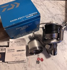 Fishing reel and lures.  Daiwa