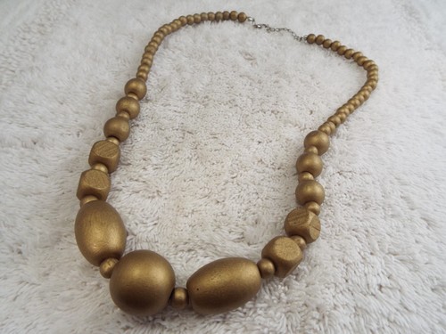 Collana perle legno - in,