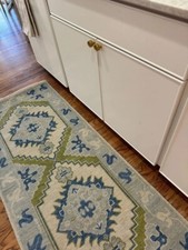 Tappeto verde annodato a mano