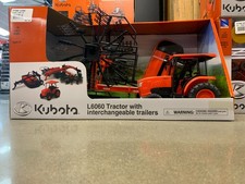 Trattore L6060 con rimorchi