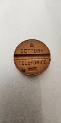 Gettone telefonico con - con, zecca