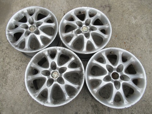 Alfa romeo set 4 cerchioni - -,